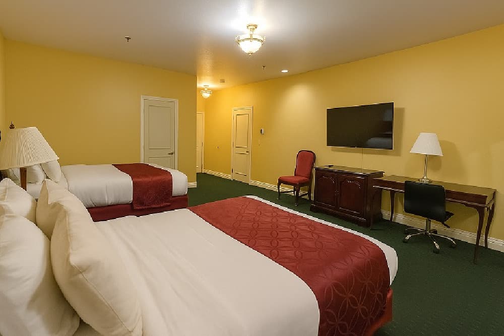 Accessible double queen room with two queen beds, a flat-screen TV and a desk
